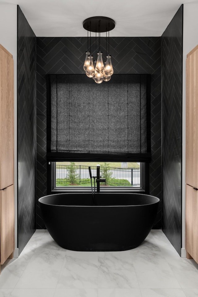 3037 Lakeshore Dr, Old Hickory, TN 37138 - bathroom with a freestanding bath, a chandelier, tile walls, and marble finish flooring
