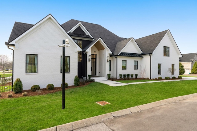 3037 Lakeshore Dr, Old Hickory, TN 37138 - modern farmhouse style home featuring a standing seam roof, a front lawn, a metal roof, and a shingled roof