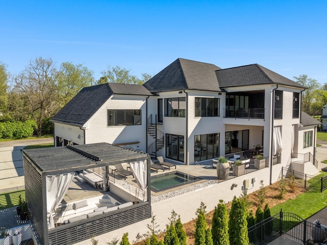 3037 Lakeshore Dr, Old Hickory, TN 37138 - rear view of property with a balcony, stucco siding, an in-ground hot tub, a fenced backyard, and a patio area