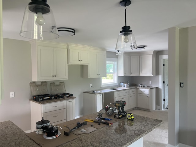 3626 Pulaski Hwy, Columbia, TN 38401 - kitchen featuring stone countertops, white cabinetry, and pendant lighting