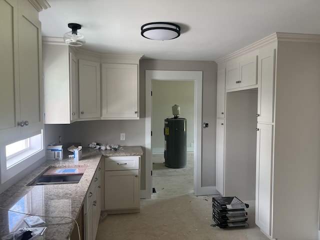 3626 Pulaski Hwy, Columbia, TN 38401 - kitchen with electric water heater and white cabinets