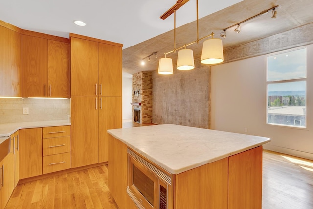 417 Frazier Ave Unit 404, Chattanooga, TN 37405 - kitchen with rail lighting, light wood-type flooring, stainless steel microwave, and recessed lighting