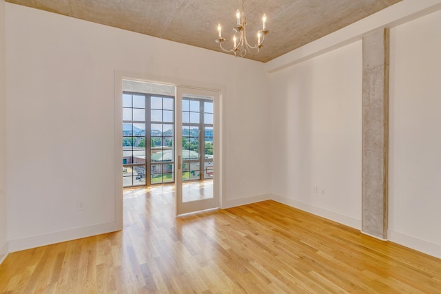 417 Frazier Ave Unit 404, Chattanooga, TN 37405 - unfurnished room with a chandelier and light wood-style flooring