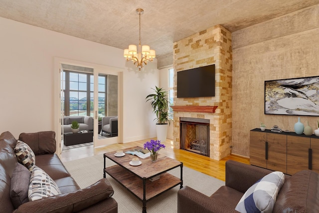 417 Frazier Ave Unit 404, Chattanooga, TN 37405 - living area featuring light wood finished floors, a chandelier, and a fireplace