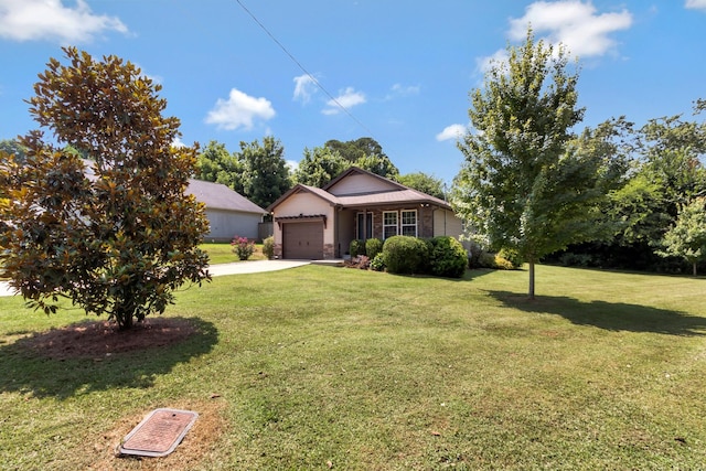 200 Woodsong Ln, Columbia, TN 38401 - view of front of house with a garage, concrete driveway, a front yard, and brick siding