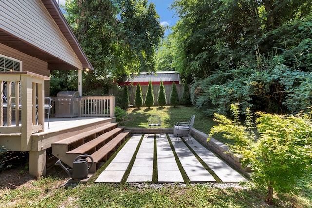 200 Woodsong Ln, Columbia, TN 38401 - wooden terrace with a grill and a patio area
