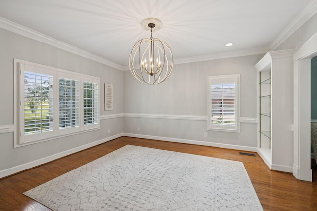 103 Wellesley Pl, Columbia, TN 38401 - spare room with a chandelier, wood finished floors, and crown molding