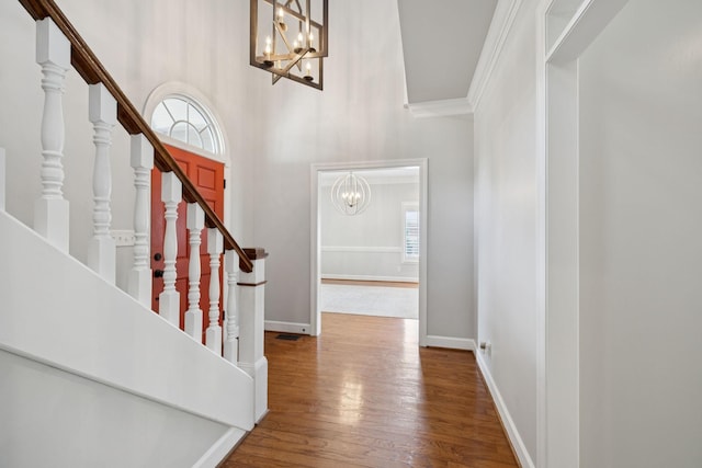 103 Wellesley Pl, Columbia, TN 38401 - foyer featuring a chandelier, wood finished floors, stairs, a towering ceiling, and ornamental molding