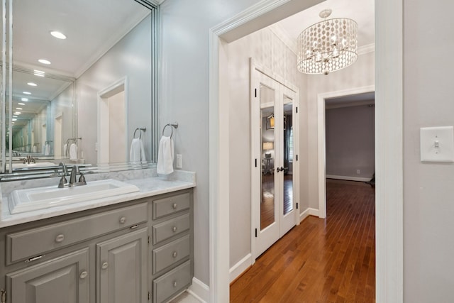 103 Wellesley Pl, Columbia, TN 38401 - bathroom with ornamental molding, wood finished floors, vanity, a chandelier, and recessed lighting