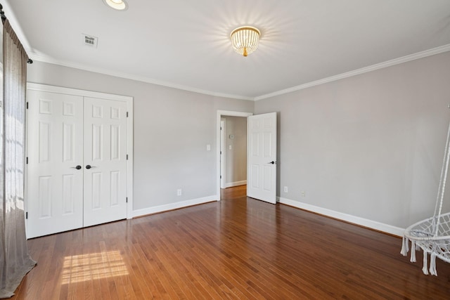 103 Wellesley Pl, Columbia, TN 38401 - unfurnished bedroom with crown molding, wood finished floors, and a closet