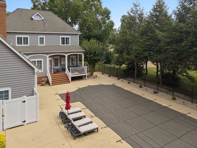 103 Wellesley Pl, Columbia, TN 38401 - rear view of house with a shingled roof, a fenced backyard, and covered porch