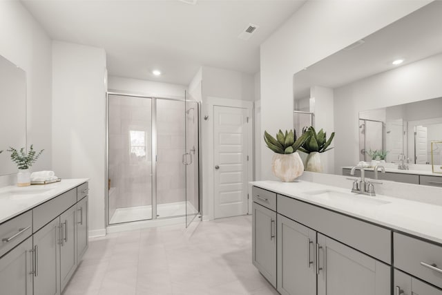 2453 Williams Ridge Dr, Columbia, TN 38401 - bathroom with two vanities, a shower stall, and recessed lighting