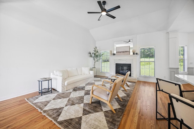 9401 Lazy Circles Dr, Ooltewah, TN 37363 - living area with a ceiling fan, wood finished floors, vaulted ceiling, and a fireplace