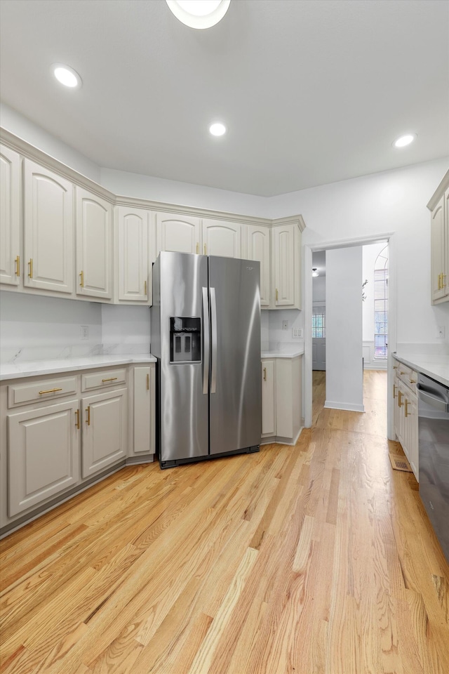 9401 Lazy Circles Dr, Ooltewah, TN 37363 - kitchen featuring stainless steel appliances, light countertops, light wood-style flooring, and recessed lighting