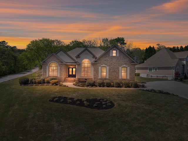 9401 Lazy Circles Dr, Ooltewah, TN 37363 - view of front of home with a front lawn, french doors, and brick siding