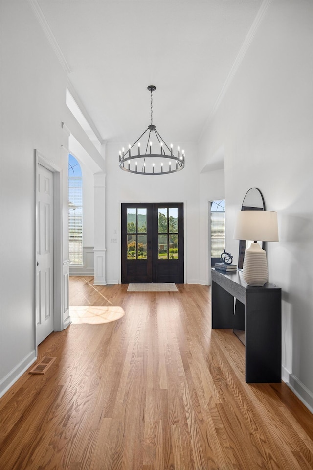 9401 Lazy Circles Dr, Ooltewah, TN 37363 - entryway with a chandelier, ornamental molding, wood finished floors, french doors, and a high ceiling
