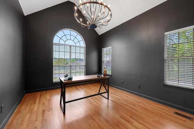 9401 Lazy Circles Dr, Ooltewah, TN 37363 - unfurnished office with lofted ceiling, a chandelier, plenty of natural light, and wood finished floors