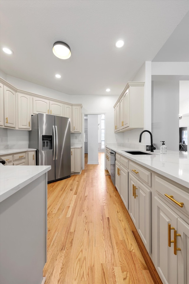 9401 Lazy Circles Dr, Ooltewah, TN 37363 - kitchen featuring appliances with stainless steel finishes, light countertops, light wood-style floors, and recessed lighting