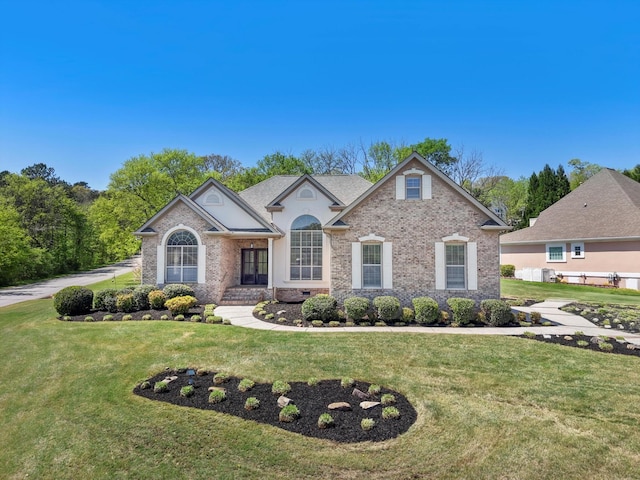 9401 Lazy Circles Dr, Ooltewah, TN 37363 - view of front of house featuring a front lawn and brick siding