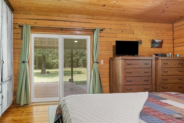 539 Bland Hollow Rd, Hohenwald, TN 38462 - bedroom featuring wooden walls, access to outside, wood ceiling, and light wood-style floors