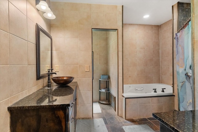 539 Bland Hollow Rd, Hohenwald, TN 38462 - full bathroom with tile walls, a whirlpool tub, vanity, and recessed lighting