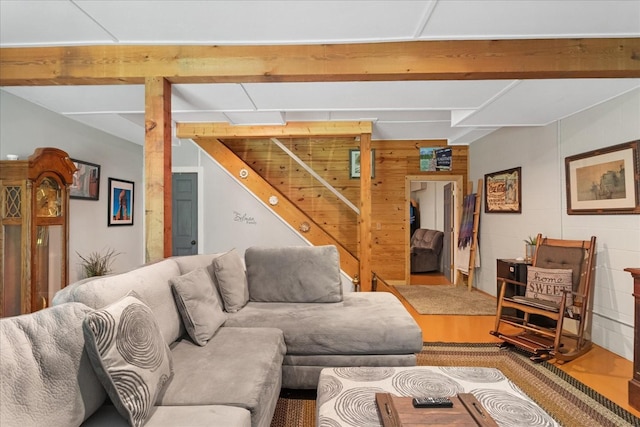 539 Bland Hollow Rd, Hohenwald, TN 38462 - living room featuring concrete block wall, beam ceiling, and wood finished floors