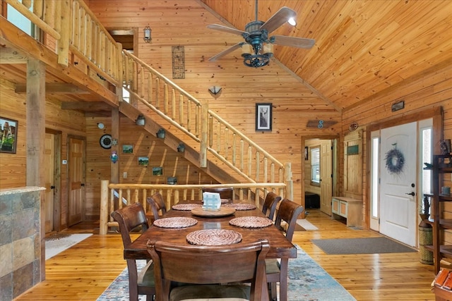 539 Bland Hollow Rd, Hohenwald, TN 38462 - dining area with wood walls, healthy amount of natural light, wooden ceiling, ceiling fan, and light wood-type flooring
