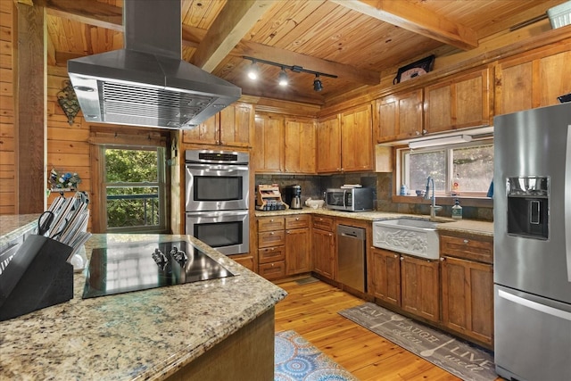 539 Bland Hollow Rd, Hohenwald, TN 38462 - kitchen with stainless steel appliances, extractor fan, light wood-style floors, decorative backsplash, and a wooden ceiling with exposed beams