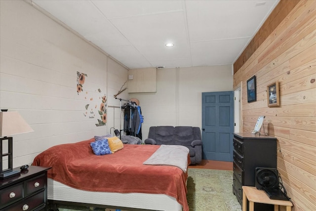 539 Bland Hollow Rd, Hohenwald, TN 38462 - bedroom with wood walls and concrete block wall