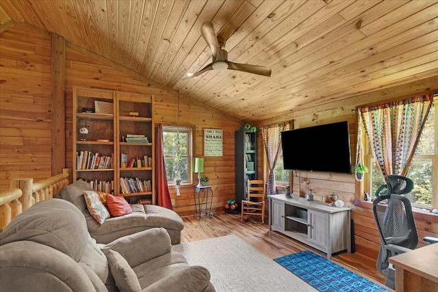 539 Bland Hollow Rd, Hohenwald, TN 38462 - living room with wood walls, vaulted ceiling, wooden ceiling, plenty of natural light, and ceiling fan