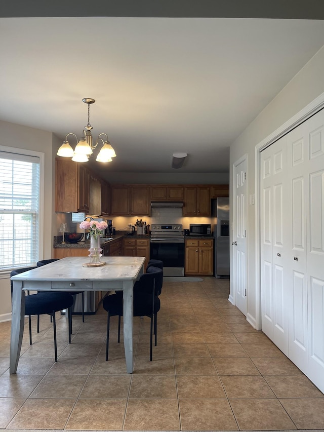 1253 Annapolis Cir, Thompsons Station, TN 37179 - dining space with a chandelier and light tile patterned floors