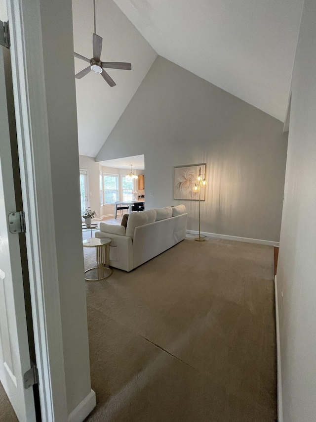 1253 Annapolis Cir, Thompsons Station, TN 37179 - living room with high vaulted ceiling, carpet floors, a ceiling fan, and a chandelier