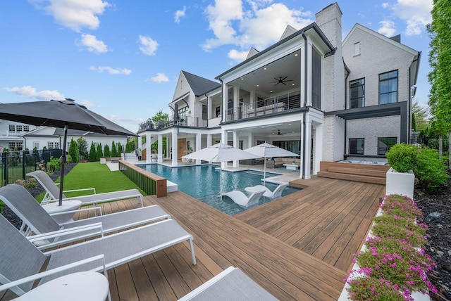 6004 Pelican Way, College Grove, TN 37046 - back of property featuring a balcony, a ceiling fan, a patio area, an infinity pool, and brick siding