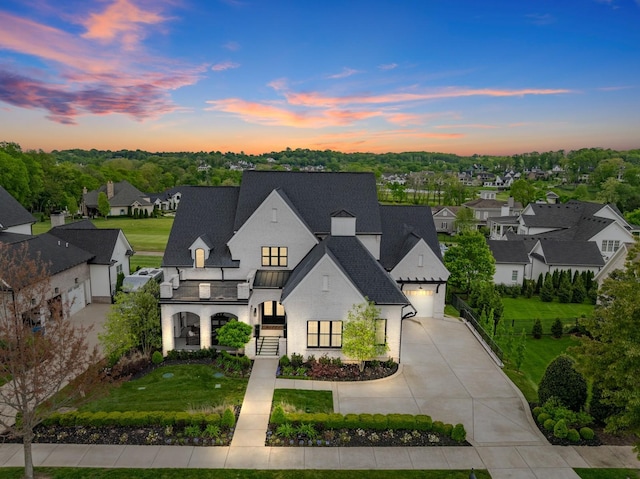 6004 Pelican Way, College Grove, TN 37046 - french country home with driveway, a yard, a balcony, roof with shingles, and a residential view