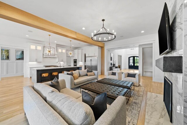 6004 Pelican Way, College Grove, TN 37046 - living room with a chandelier, light wood finished floors, a fireplace, and recessed lighting
