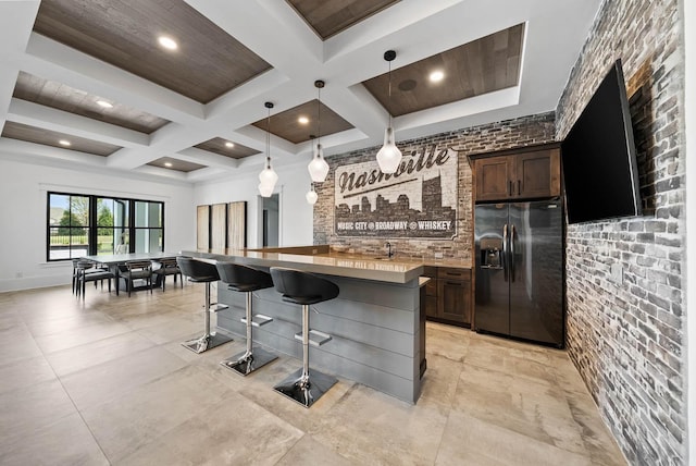 6004 Pelican Way, College Grove, TN 37046 - kitchen featuring fridge with ice dispenser, coffered ceiling, beam ceiling, a breakfast bar area, and a center island