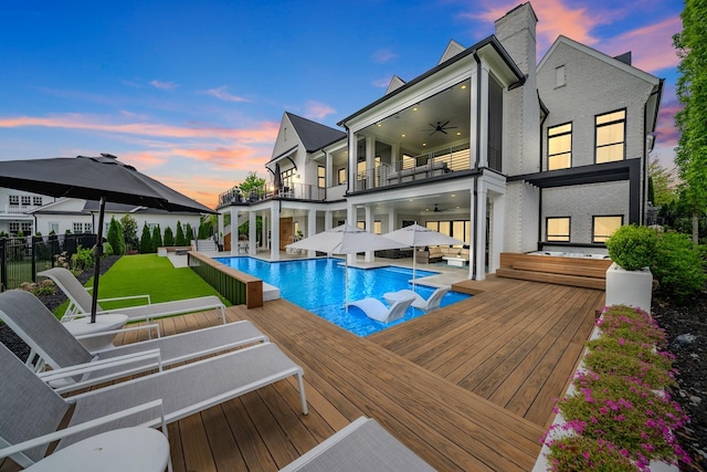 6004 Pelican Way, College Grove, TN 37046 - rear view of property featuring a balcony, a ceiling fan, an outdoor hangout area, an infinity pool, and a patio