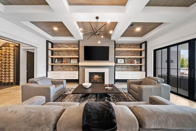 6004 Pelican Way, College Grove, TN 37046 - living room featuring coffered ceiling, a chandelier, built in features, wood finished floors, and a large fireplace
