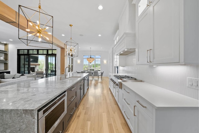 6004 Pelican Way, College Grove, TN 37046 - kitchen featuring a chandelier, stainless steel appliances, recessed lighting, light wood-style flooring, and white cabinets