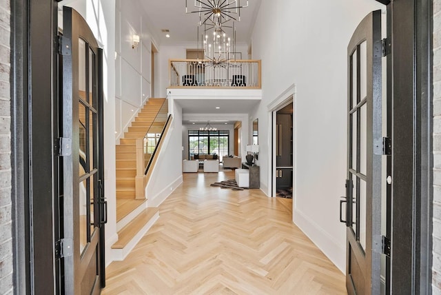 6004 Pelican Way, College Grove, TN 37046 - entrance foyer featuring stairway, a chandelier, a high ceiling, and ornamental molding