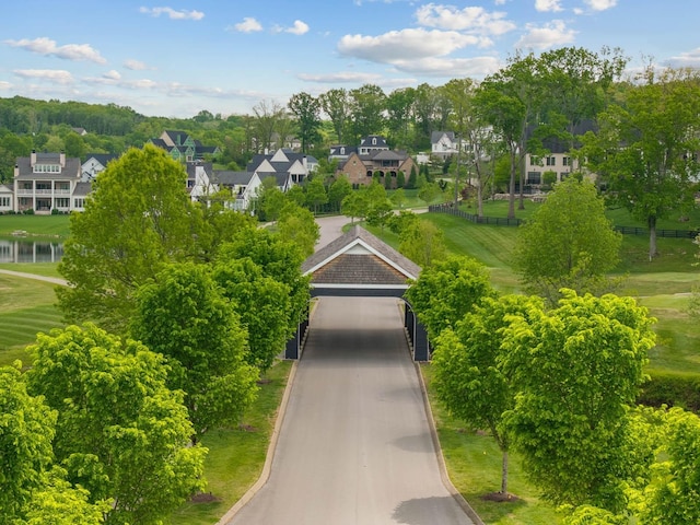 6004 Pelican Way, College Grove, TN 37046 - view of home's community with a residential view, view of scattered trees, a garage, and a water view
