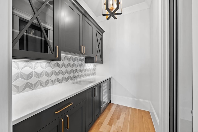 6004 Pelican Way, College Grove, TN 37046 - kitchen with tasteful backsplash, light countertops, light wood-type flooring, and wine cooler