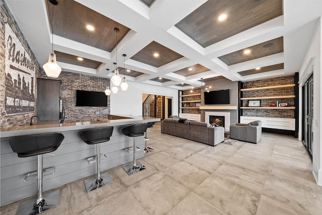 6004 Pelican Way, College Grove, TN 37046 - kitchen with a kitchen breakfast bar, built in shelves, beam ceiling, a lit fireplace, and coffered ceiling