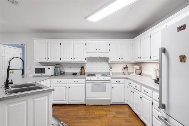 161 Cumberland Oaks Dr, Tullahoma, TN 37388 - kitchen with white appliances, white cabinets, and light wood-style floors