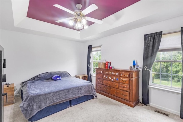 161 Cumberland Oaks Dr, Tullahoma, TN 37388 - bedroom featuring carpet, a tray ceiling, and a ceiling fan