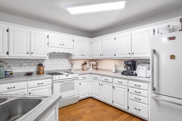 161 Cumberland Oaks Dr, Tullahoma, TN 37388 - kitchen featuring white appliances, white cabinets, backsplash, light countertops, and light wood finished floors