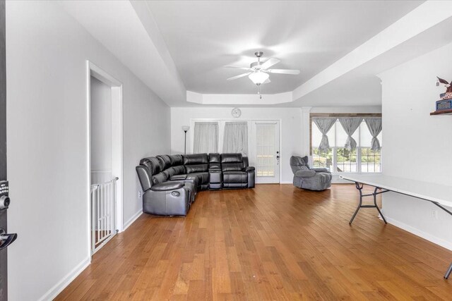 161 Cumberland Oaks Dr, Tullahoma, TN 37388 - living area with a ceiling fan, a raised ceiling, and light wood-style flooring