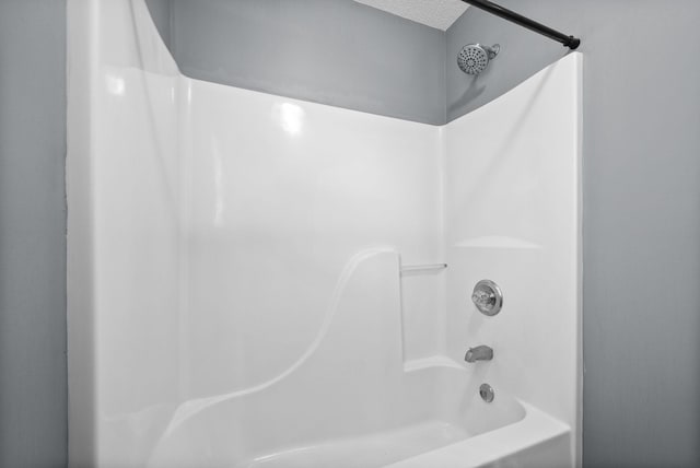 1155 Delmont Church Rd, Cadiz, KY 42211 - bathroom with tub / shower combination and a textured ceiling