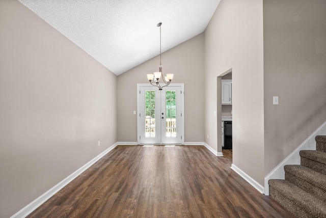 1155 Delmont Church Rd, Cadiz, KY 42211 - unfurnished dining area with dark wood finished floors, a chandelier, high vaulted ceiling, stairs, and french doors