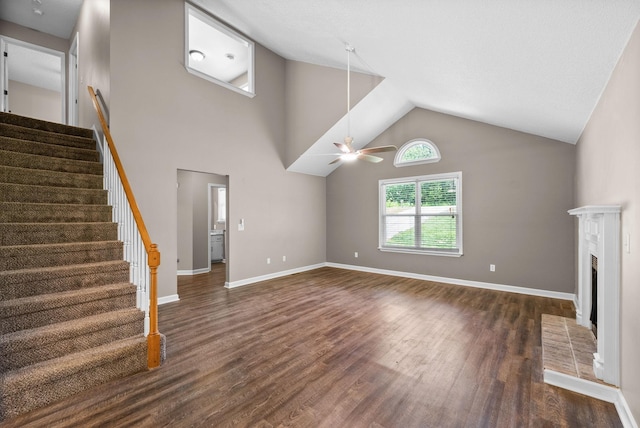1155 Delmont Church Rd, Cadiz, KY 42211 - unfurnished living room with stairway, dark wood finished floors, ceiling fan, high vaulted ceiling, and a fireplace